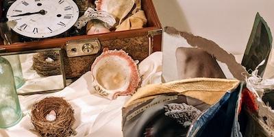 Installation with artist book, found objects, embedded ipad with video